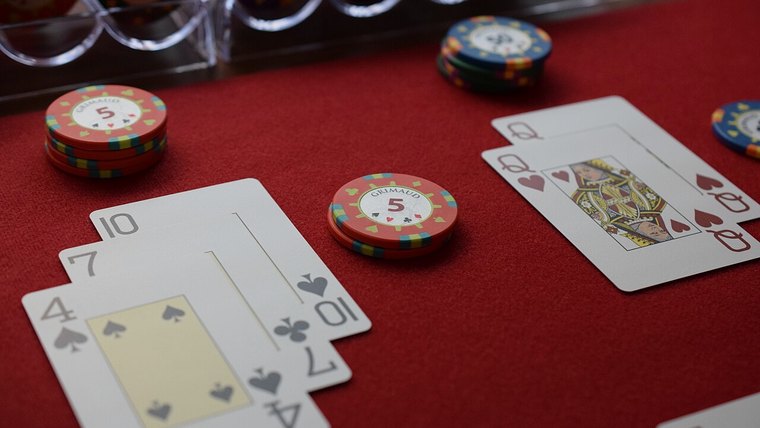 Blackjack cards and chips on the felt