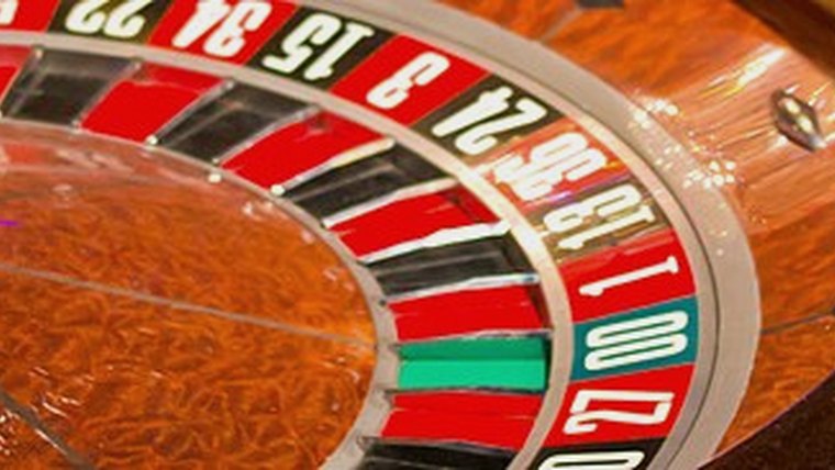 Roulette wheel spinning at a casino table
