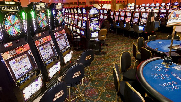 Slot machines and tables on a casino floor