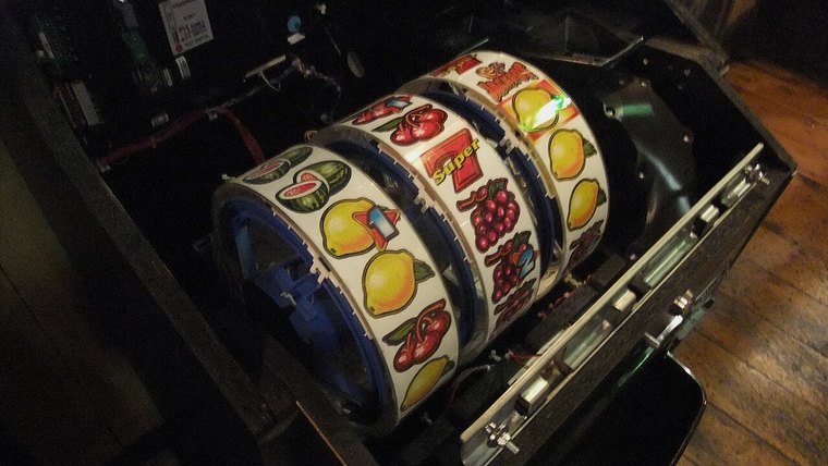 Mechanical slot machine reels with fruit symbols